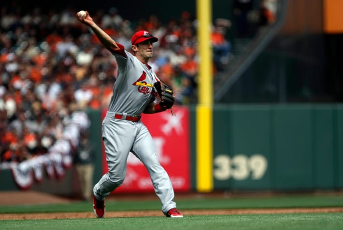 April 05, 2013; San Francisco, CA, USA; St. Louis Cardinals third baseman Matt Carpenter (13) throws the ball to first base against the San Francisco Giants during the third inning at AT&T Park. Mandatory Credit: Kelley L Cox-USA TODAY Sports